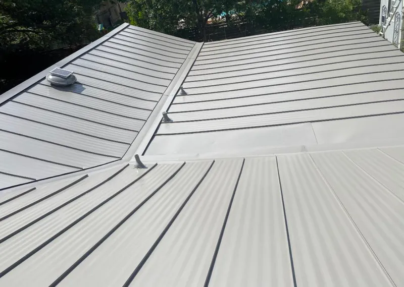 Solar attic fan installed on a metal roof for Roof Ventilation in Scottsbluff